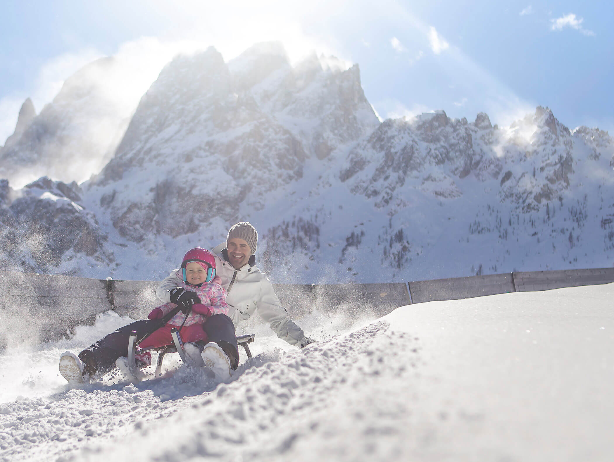 Father and daughter sledding
