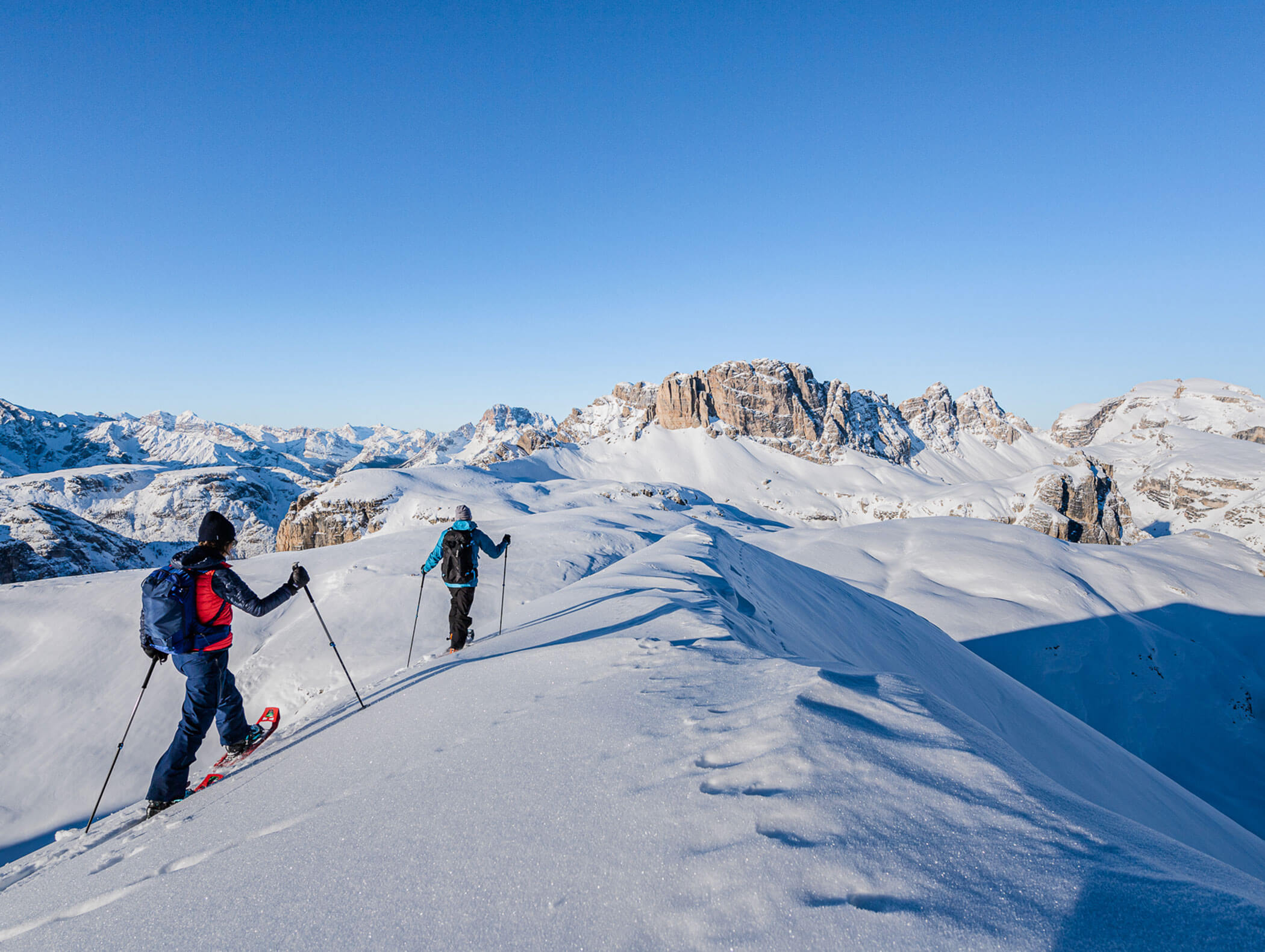 Two snowshoe hikers in the Dolomites